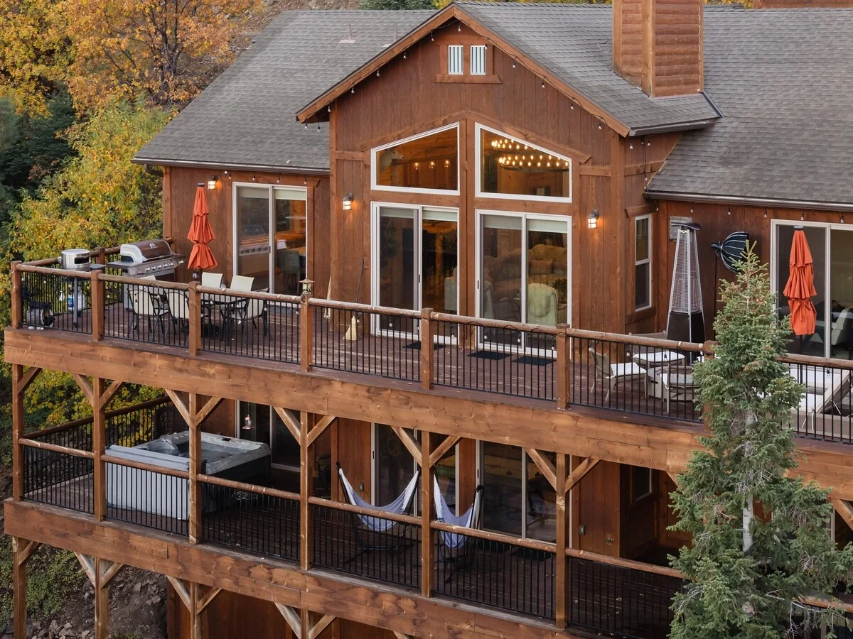 Exterior view of Eagle's Peak Lodge and its large decks in autumn