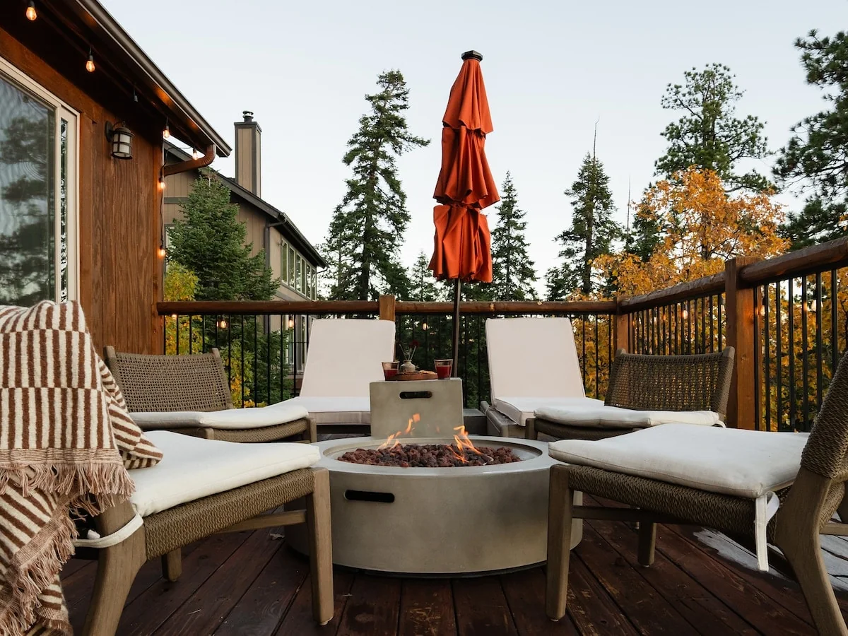 Deck lounge arranged around the propane fire pit