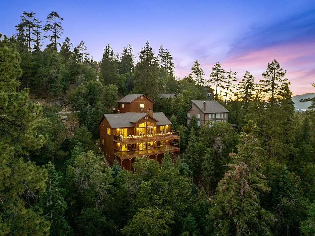 Eagle's Peak Lodge nestled among pine trees at dusk